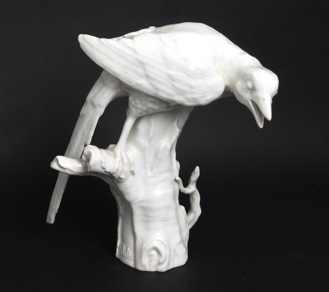 KPM BERLIN PORCELAIN MAGPIE BIRD FIGURE: Titled 'Elster (Magpie)' to lower side. 20th century. Dimensions: H 10.5" x W 7" x D 11.5" Condition: Light surface marks. Wear consistent with age and use.