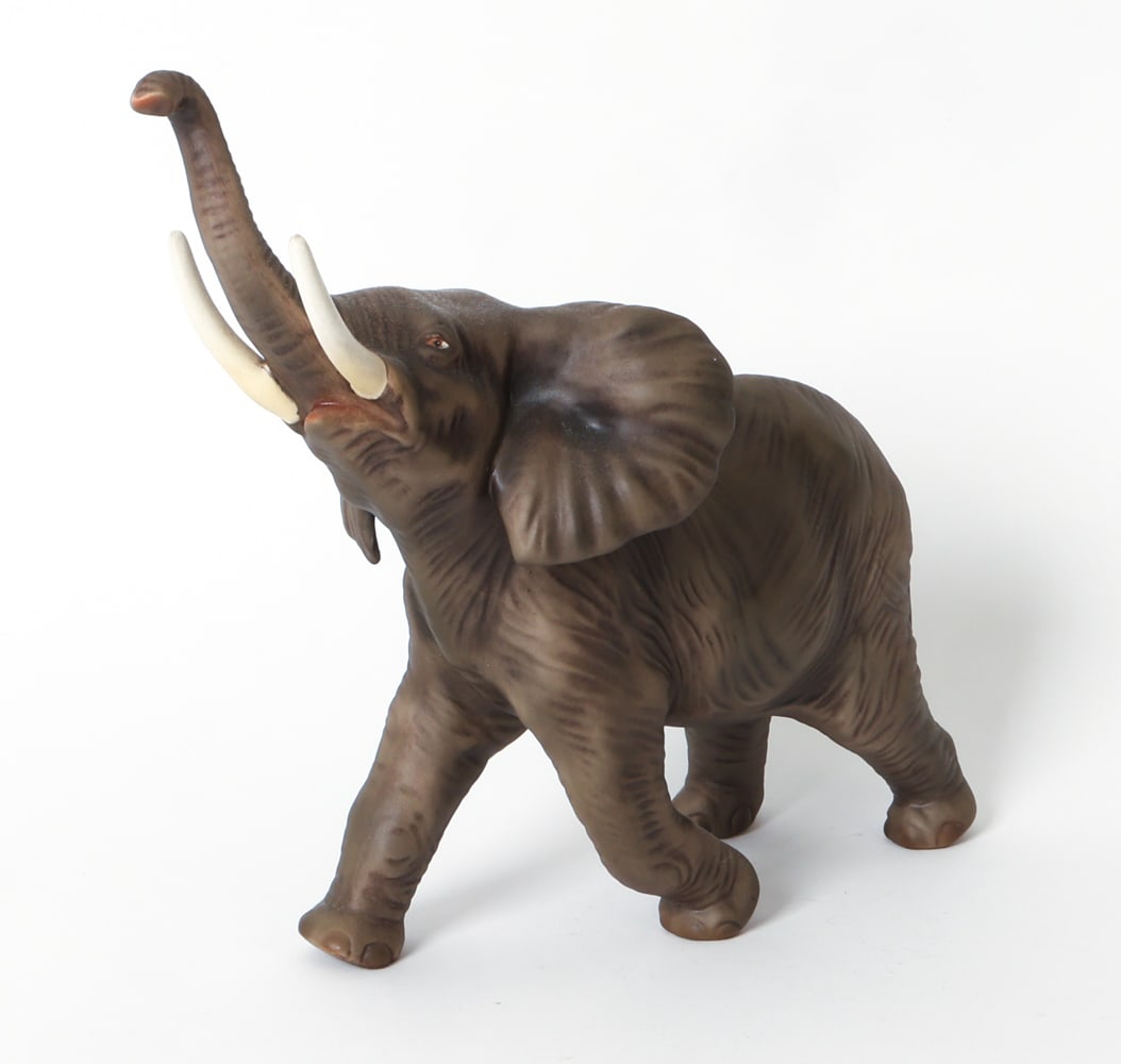 GOEBEL GERMAN PORCELAIN ELEPHANT FIGURINE: Marked underneath. 20th century. Dimensions: H 10.25" x W 5.75" x D 11". Condition: Wear consistent with age and use.