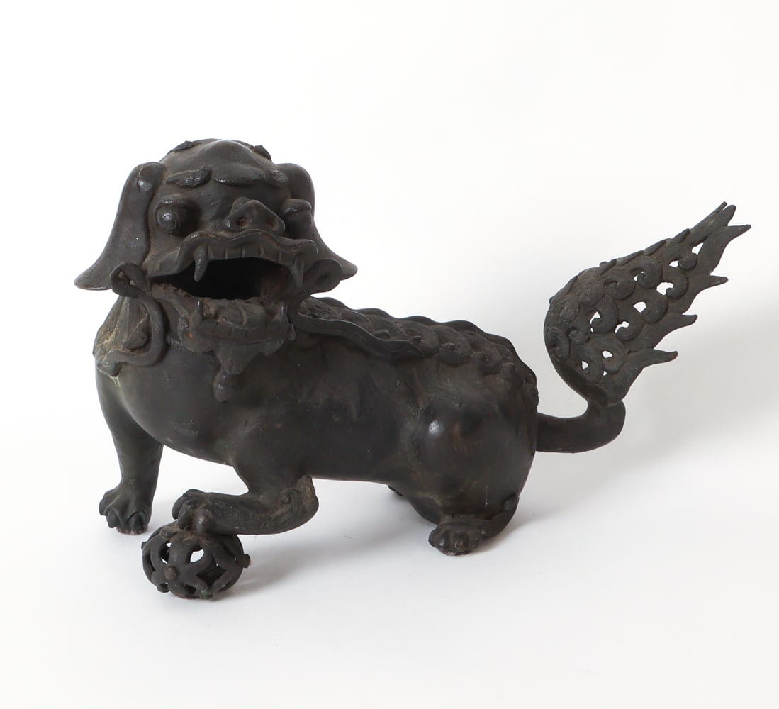 ANTIQUE CHINESE BRONZE FOO DOG CENSER: Patinated bronze foo dog figure. Dimensions: H 10.5" x W 6.75" x D 16.5". Condition: Scuffs, rubs, and light surface soiling to crevices. Wear consistent with age and use.