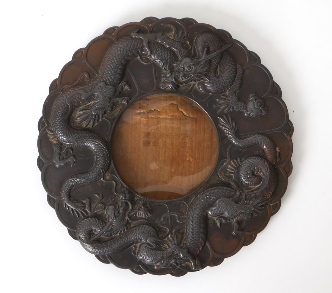 ANTIQUE JAPANESE DRAGON FRAME: Round plated white metal frame with dragon motif. Japan, circa 19th century. Dimensions: Dia 7.5" Condition: Patina to metal with few spots of oxidation. Scuffs and rubs. Wear consistent with age and 