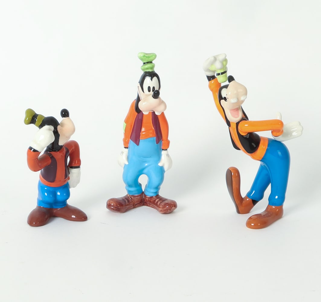 DISNEY CERAMIC GOOFY FIGURE GROUPING: Grouping of (3) Goofy figures. Marked under shoes. 20th century. Dimensions: Largest H 6.25" x W 3" x D 3". Condition: Faint scuffs. Previous repair to foot of one. Wear consistent with age and use.