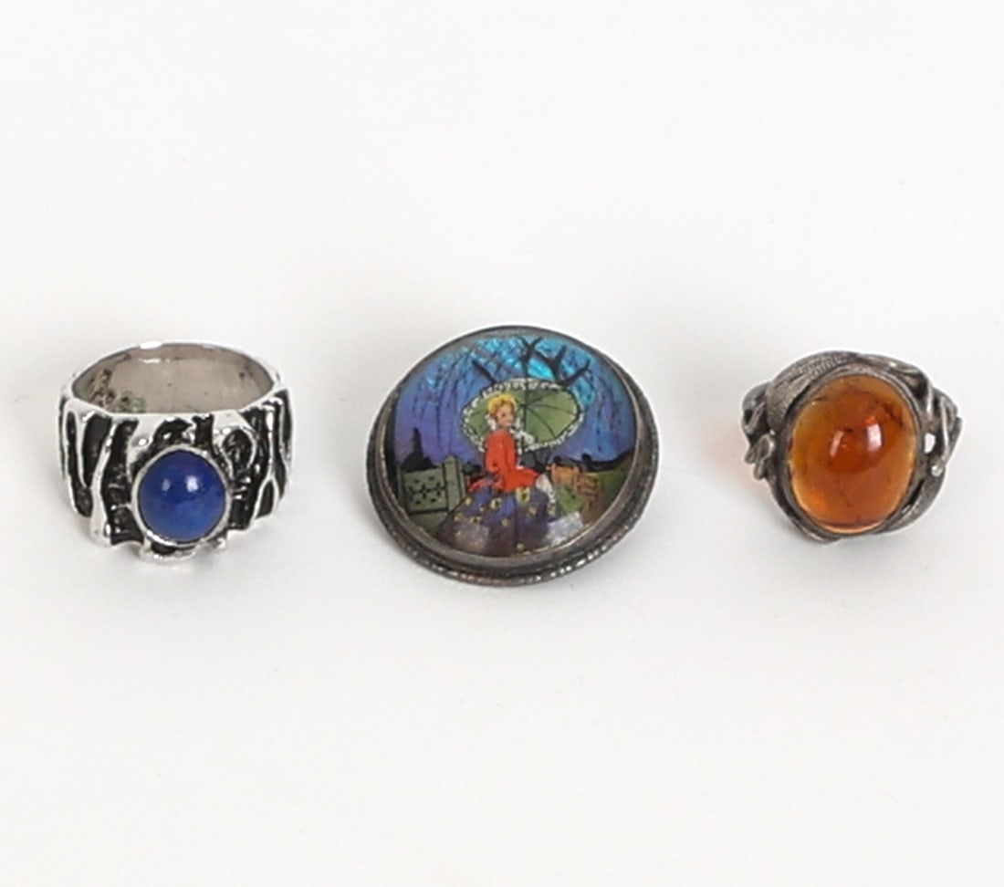 STERLING SILVER JEWELRY GROUPING: Grouping of (3) sterling silver jewelry items including two modernist rings and one art deco English butterfly wing pictoral brooch. One ring and pin are marked. Dimensions: Dia. Pin 1". Ring Sizes. o