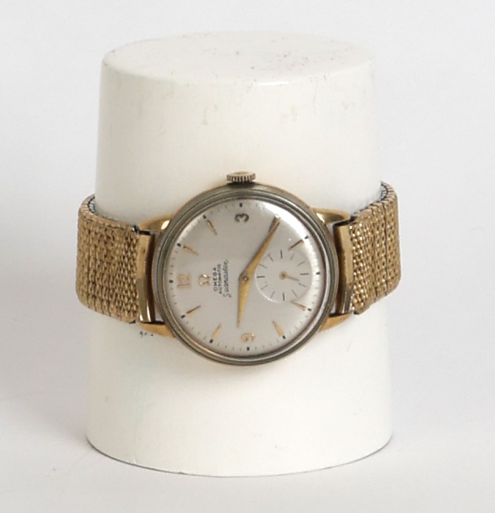 OMEGA SEAMASTER 14K GOLD FILLED WATCH: Omega Seamaster watch featuring automatic movement and sub-seconds dial. Marked on back. Dimensions: Dia. 2.25". Condition: Timekeeping untested. Light scuffs and rubs with small dings. Wear consisten