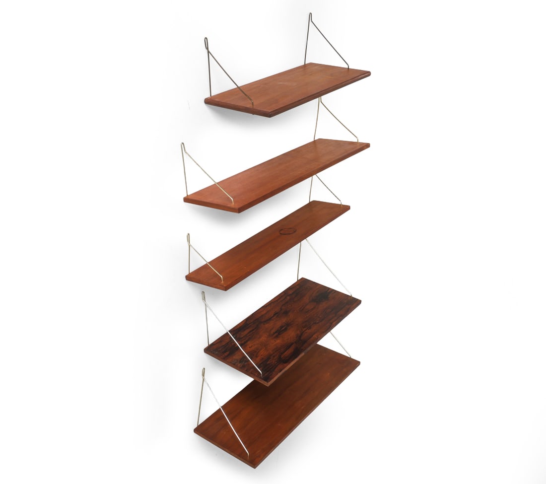 DANISH TEAK & ROSEWOOD SHELF GROUPING C. 1960S: Grouping 5 shelves in teak and rosewood with brass hangers. Denmark, circa 1960s. Dimensions: (Each shelf) H 0.5" x W 31.5" x D 9" Condition: Losses to veneer. DA_26