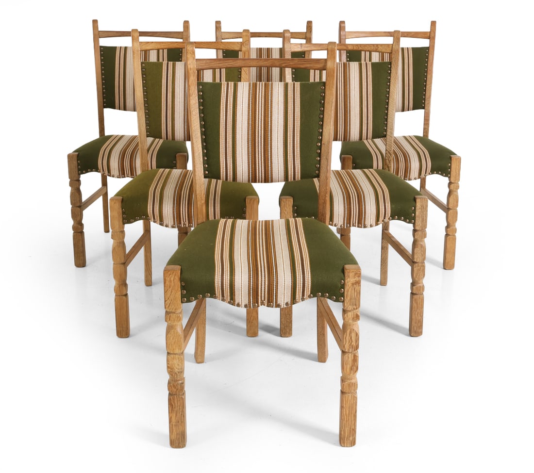 (6) STYLE OF KJAERNULF DANISH OAK DINING CHAIRS: Six dining chairs in carved oak. Curved front and turned legs. Stripe upholstery with brass tack details. Denmark, circa 1970s. Dimensions: H 34" x W 19" x D 18" x SH 18" DA_49