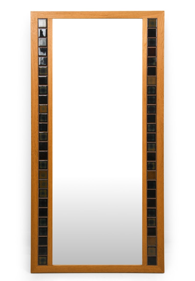 ATTR. ERIK WORTS DANISH OAK & TILE MIRROR 1960S: Vertical wall mirror with ceramic details. In oak frame. Apparently unmarked. Denmark, circa 1960's. Dimensions: H 46" x W 23" Condition: Wear consistent with age and use. Watermarks, discoloration sp