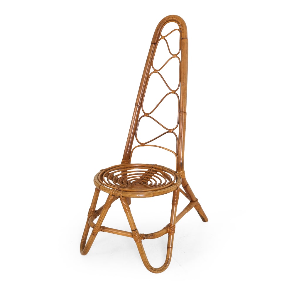 STYLE OF DIRK VAN SLIEDREGT BAMBOO CHAIR: Dutch high back chair with sculptural curves and circular seat in woven bamboo and cane frame. Dimensions: H 42" x W 17" x D 22" x SH 14" Condition: Wear consistent with age and use, including scuffs 