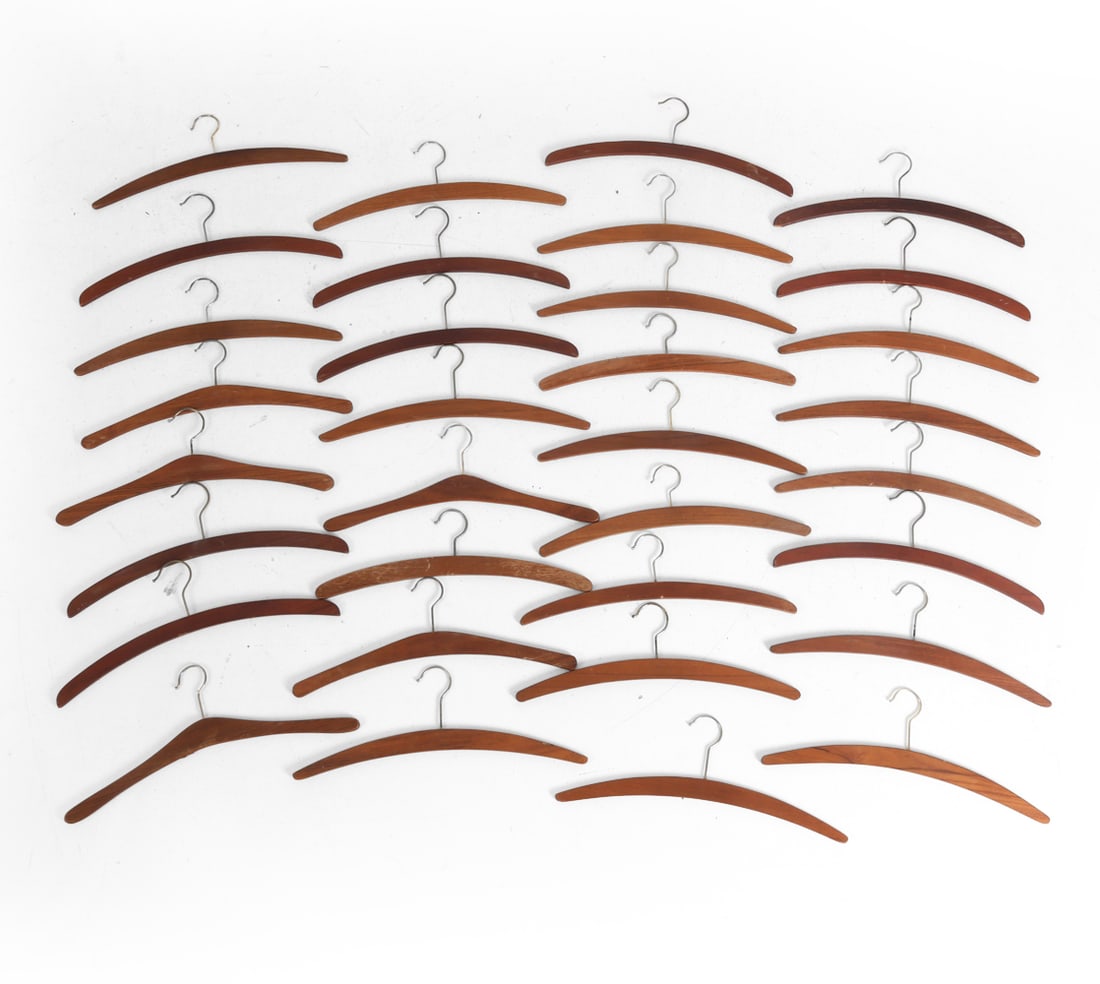 DANISH TEAK COAT HANGERS GROUPING: (33) Hangers total. Dimensions: H 7" x W 17". Condition: Variety of wear including rubs, scratches, small losses. Wear consistent with age and use. DA_232