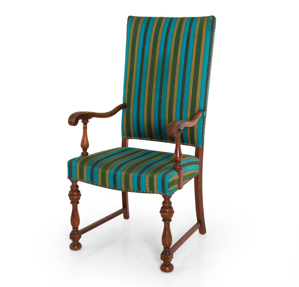 ANTIQUE DANISH OAK HIGHBACK ARMCHAIR: Striped upholstery with carved arms and legs. Dimensions: H 45" x W 22" x D 22" x SH 17.5" Condition: Wear consistent with age and use, including fading and scratches. Discoloration to upholstery. DA_