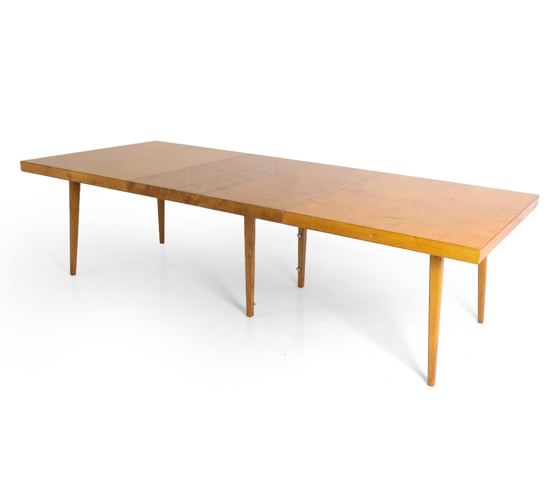 AB J. O. CARLSSONS SWEDISH BIRCH DINING TABLE: (2) Leaves included. Tagged underneath. Sweden, circa 1960s. Dimensions: H 29.5" x W 71" x D 45". Leaves W 19.75". Condition: Scratches, scuffs, and dings. Previous repair to top at seam. Wear consist