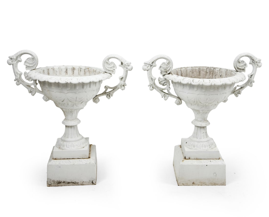 PAIR OF CLASSICAL CAST IRON GARDEN URNS: Pair of garden urns with classical Roman or Victorian design. White painted finish. Dimensions: H 30" x W 29" x D 18.5". Condition: Surface soiling. One with a loss to a handle element as shown. Peeli