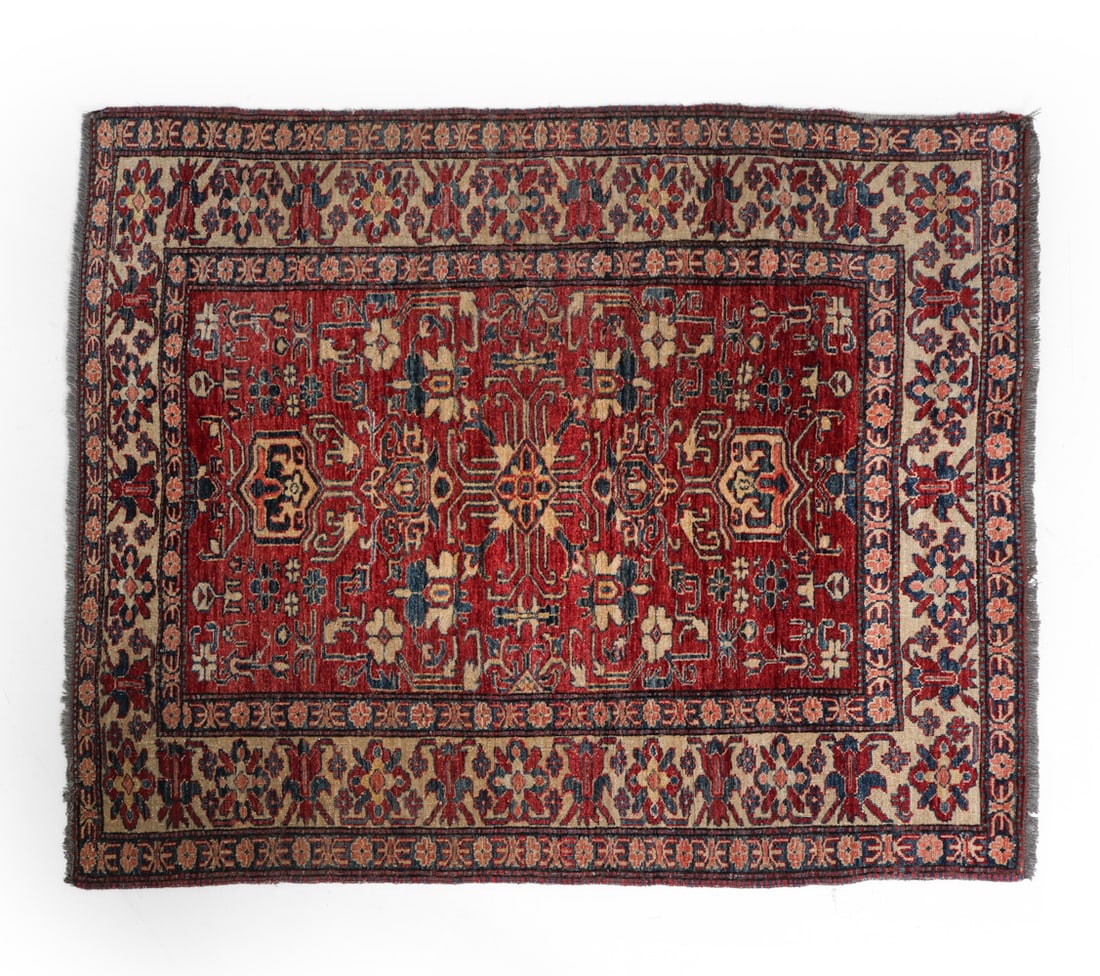 PERSIAN HERIZ RUG: It features a bold, geometric medallion with stylized floral forms & angular corners. Dimensions: L 73" x W 61" Condition: Fading throughout, loss of fringe to corner, loss of edge to corner, loss of 