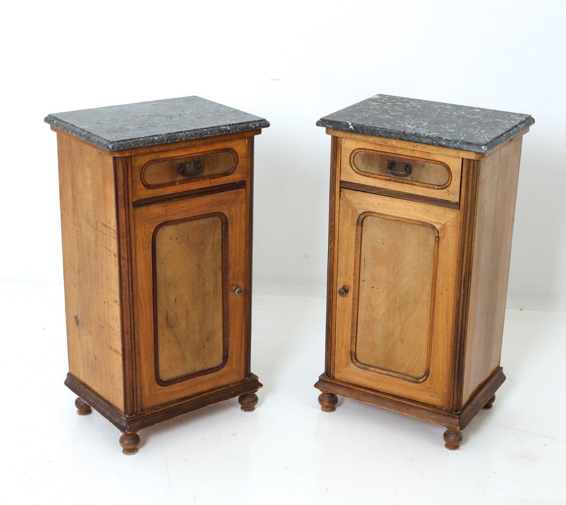 PAIR OF MARBLE & WALNUT NIGHTSTANDS: Two walnut veneer nightstands with marble tops. Each with one cabinet and one drawer. Removable shelf inside cabinets. Tag to one door from Vienna, Austria. Brass hardware. Dimensions: H 32" x W 18" x