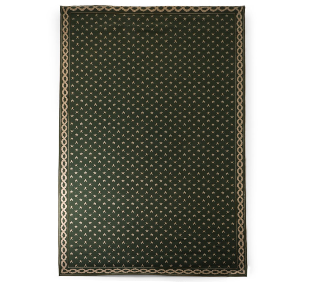 LARGE STARK CARPET: Green pattern with star motif design large area rug. Labeled to underside. Dimensions: H 120" x W 217" Condition: Wear consistent with age and use. Distress to one corner. Small tear to one edge.