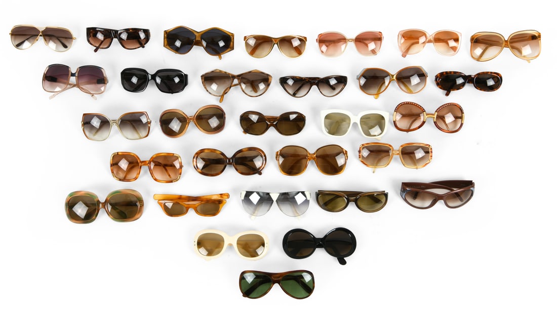 LARGE GROUPING OF SUNGLASSES INCL. CHRISTIAN DIOR: Lot of vintage sunglasses including C. Dior, Ted Lapidus Paris & more. Dimensions: H 6" x W 2" x D 3" Condition: Wear consistent with age and use.