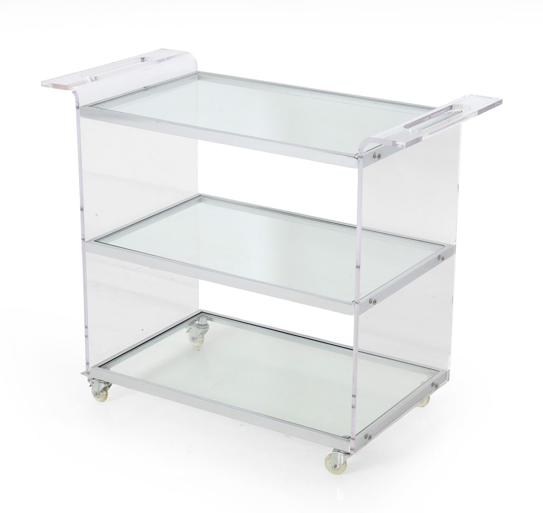 LUCITE & CHROME BAR CART: Bar cart with casters featuring three glass shelves with chrome edges. 20th Century. Dimensions: H 31" x W 37.5" x D 18" Condition: Wear consistent with age and use. Scuffs and rubs.