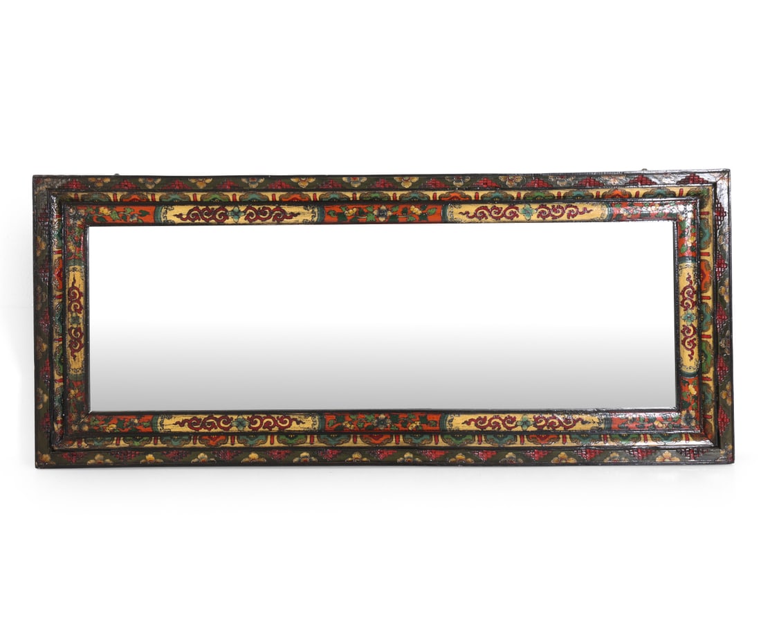 TIBETAN POLYCHROME MIRROR: Polychrome painted wooden mirror with beveled glass. Brass hanging brackets to back. Apparently unmarked. Dimensions: H 31.5" x W 74.5". Condition: Scuffs, dings to frame. Faint scuffs to glass. Wear