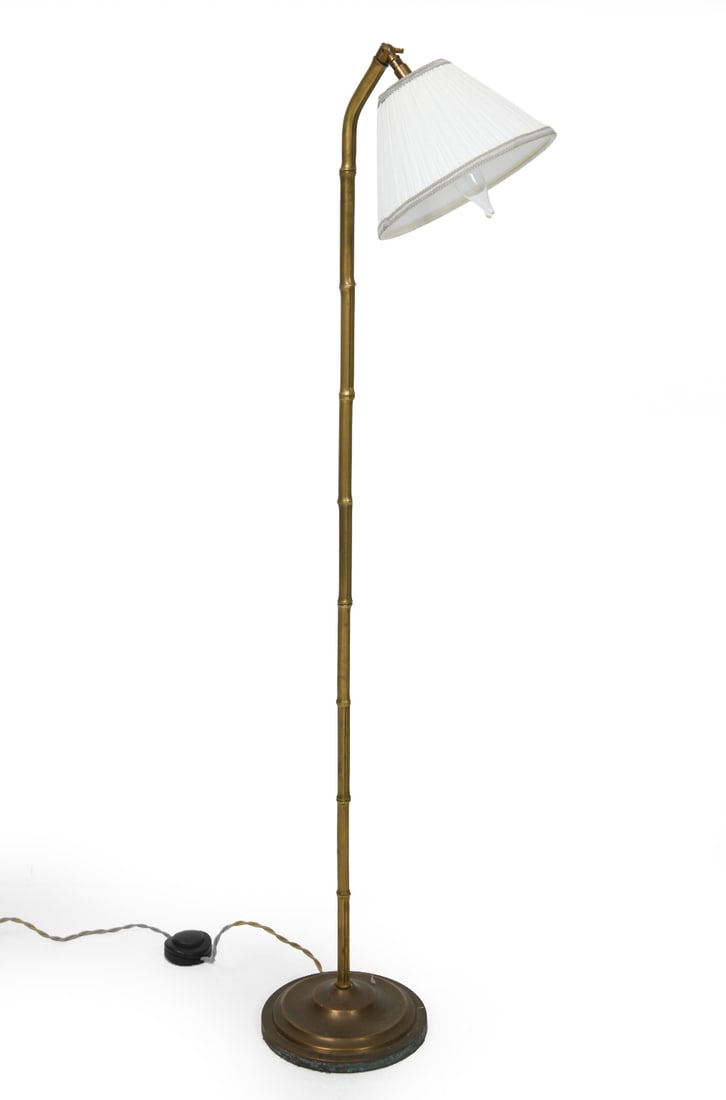 FRENCH STYLE FAUX BAMBOO BRASS FLOOR LAMP: Brass floor lamp in faux bamboo design with white shade. Dimensions: H 44.5" x Dia. 8". Condition: Wiring untested. Patina and oxidation to brass. Wear consistent with age and use.
