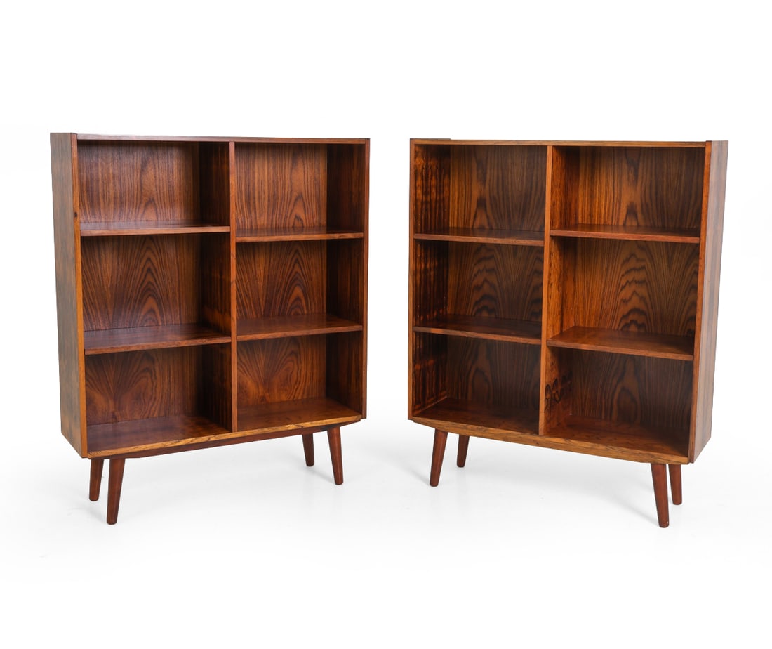 PAIR ATTR. GUNNI OMANN DANISH ROSEWOOD BOOKCASES: Dimensions: H 44" x W 35" x D 11". Condition: Light scuffs and scratches to shelves. Wear consistent with age and use. E124