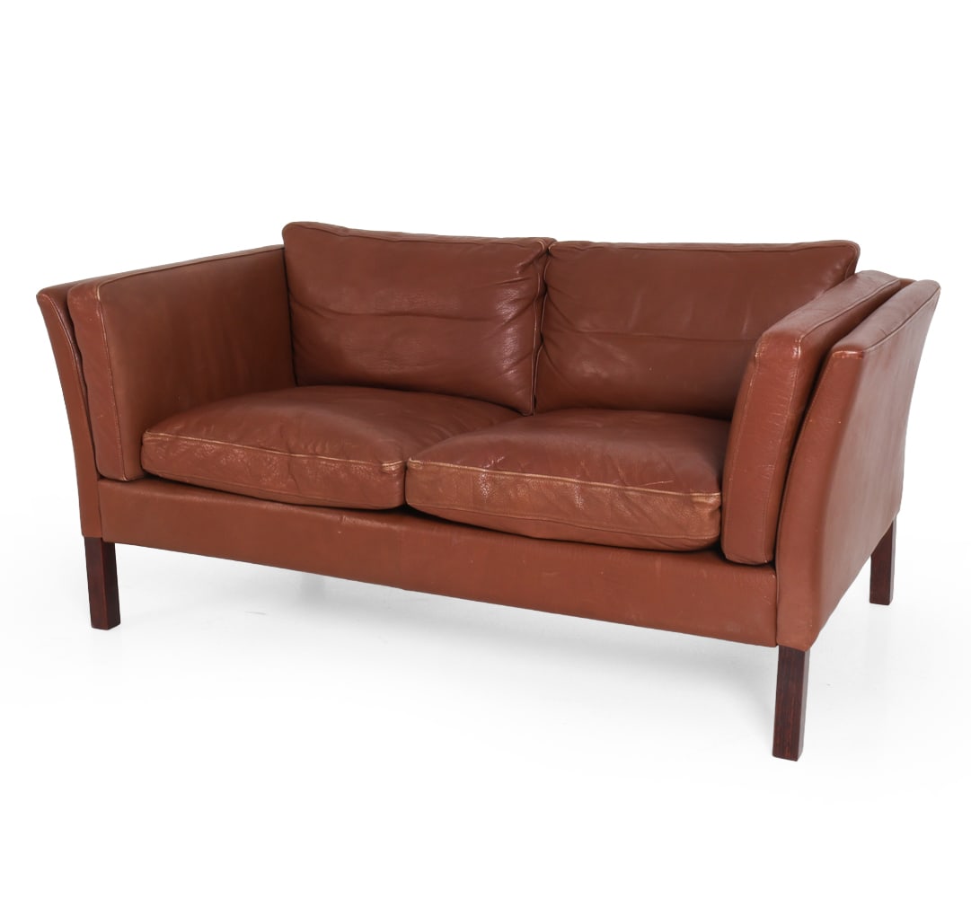 STOUBY DANISH LEATHER SOFA C. 1970S: Marked to lining under cushions. Denmark, circa 1970s. Dimensions: H 25.5" x W 58" x D 32.5" x SH 17.25". Condition: Scuffs and rubs to leather. Wear consistent with age and use.