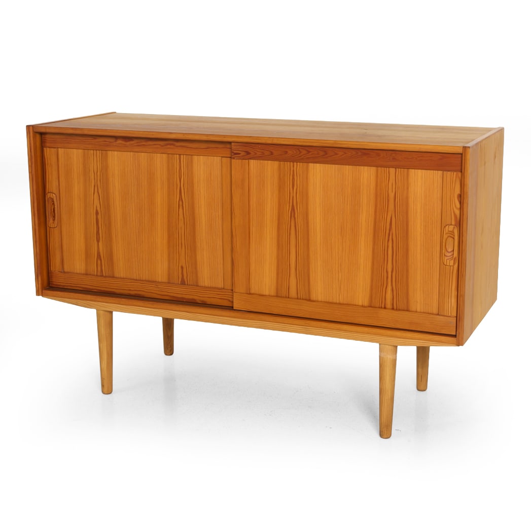 SCANDINAVIAN PINE CABINET C. 1970S: Adjustable shelves. Dimensions: H 29.25" x W 47" x D 17". Condition: Scuffs and scratches. Wear consistent with age and use. E108