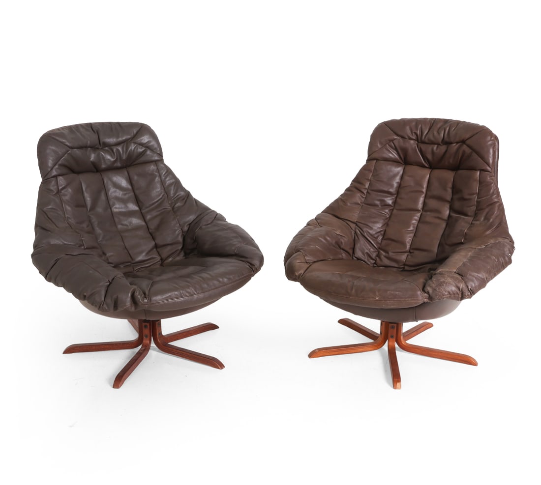 PAIR OF H. W. KLEIN DANISH LEATHER SWIVEL CHAIRS: For Bramin. Apparently unmarked. Brown leather upholstery with beech swivel bases. Denmark, circa 1970s. Dimensions: H 37" x W 35" x D 31.5" x SH 15.5". Condition: Scuffs and rubs to leather, slight
