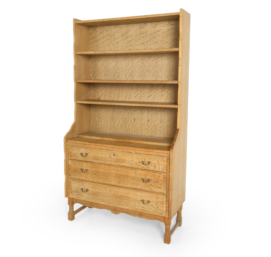 STYLE OF KJAERNULF OAK SECRETARY BOOKCASE C. 1970S: Key included. Pull-out secretary desk to lowest shelf. Adjustable shelves. Denmark, circa 1970s. Dimensions: H 72.5" x W 39.5" x D 17.75". Condition: Water rings and fading present. Wear consistent wi