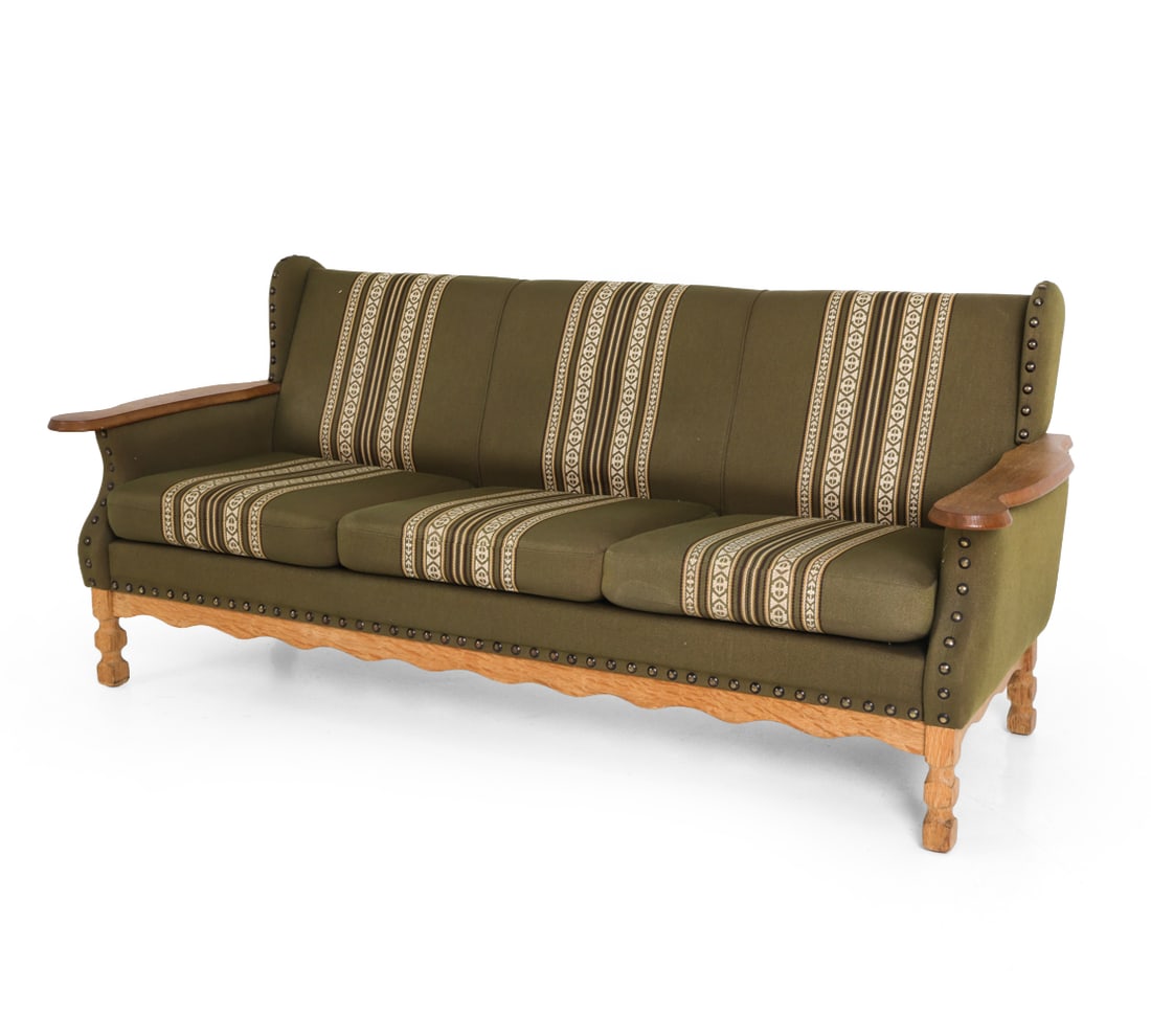 ATTR. HENNING KJAERNULF DANISH OAK SOFA C. 1960S: Dimensions: H 32" x W 74.5" x D 30" x SH 16.5". Condition: Discolored area to back. Few water spots to arms. Wear consistent with age and use. E031