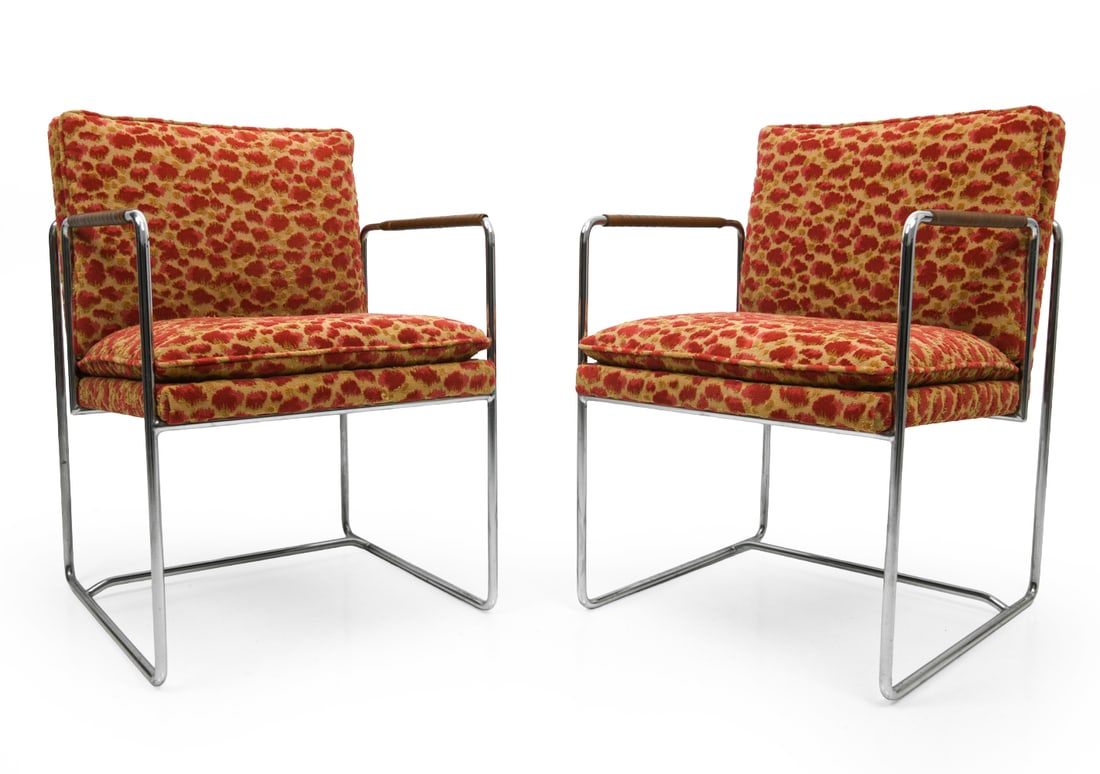 PAIR OF BAUGHMAN STYLE CHROME ARMCHAIRS: Leather wrapped armrests. Apparently unmarked. Dimensions: H 31.5" x W 21.5" x D 22.25" x SH 18.5". Condition: Rubs and tears to leather on arms. Fading to fabric. Wear consistent with age and use.