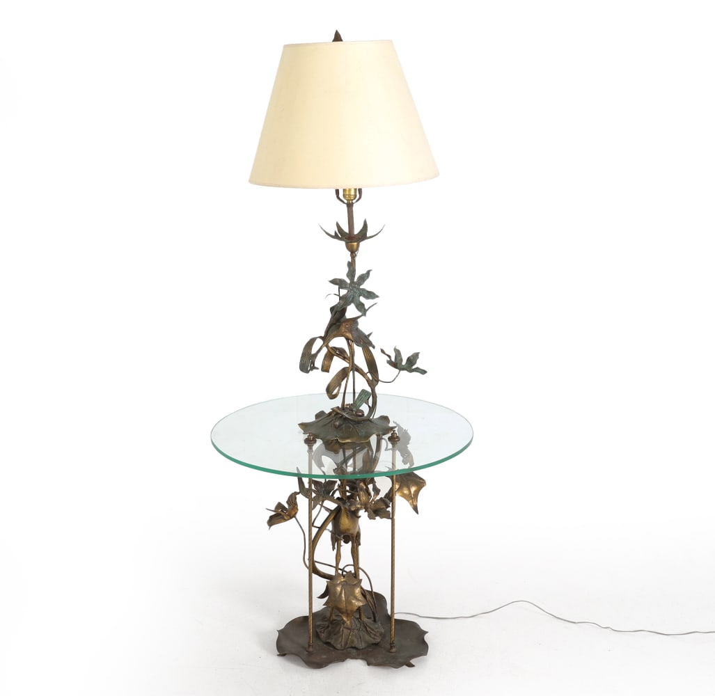HOLLYWOOD REGENCY STYLE STORK LAMP TABLE: Cast metal lamp table with stork design. 20th century. Dimensions: H 62" x Dia. 26.5". Condition: Wiring previously in working condition. Chip to glass table top. Patina. Wear consistent with age and