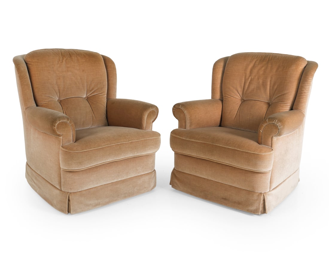 PAIR OF SCANDINAVIAN VELOUR LOUNGE CHAIRS 1970S: (2) Lounge chairs with beige velour upholstery. Skirt to base. Rolled arms and tufted backs. Scandinavian, circa 1970s. Dimensions: H 37" x W 32" x D 33" x SH 17.5". Condition: Few faint discolored sp
