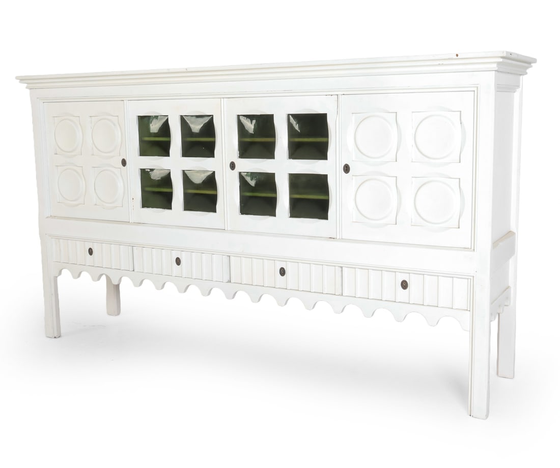 HENNING KJAERNULF PAINTED OAK SIDEBOARD C. 1970S: (2) Keys included. Oak sideboard in white painted finish. Convex glass panels to center cabinet door. Adjustable shelves. Carved motif to cabinet doors. Apparently untagged. Denmark, circa 1970s. Dime