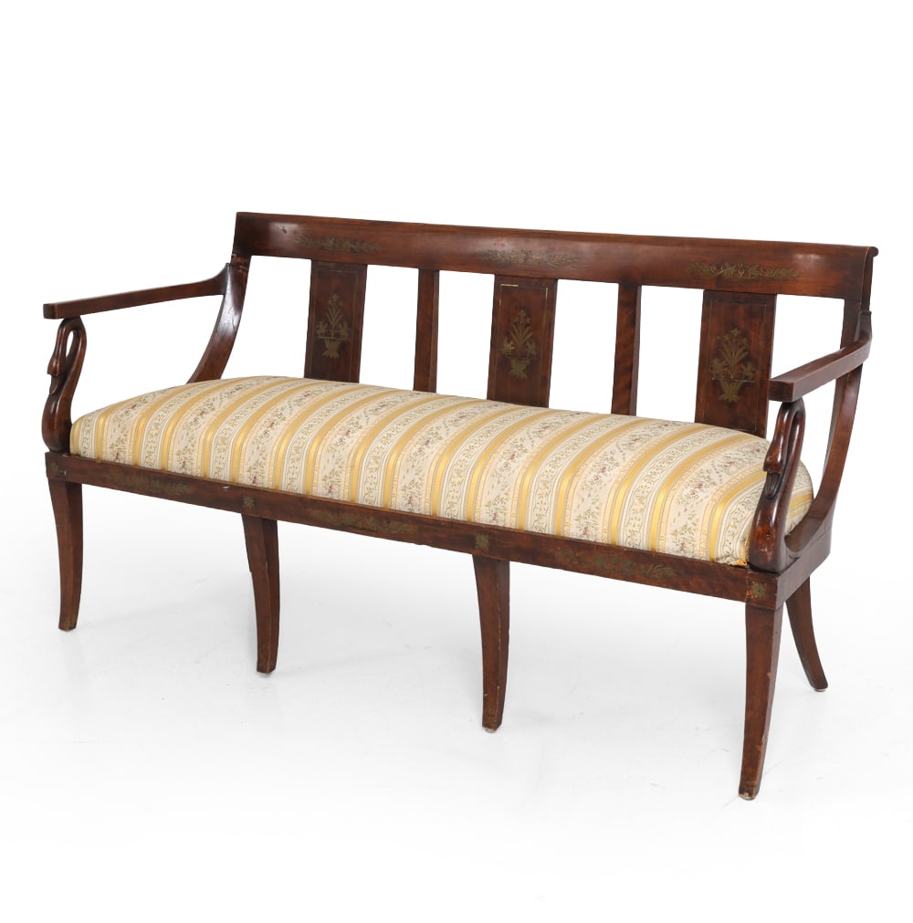 EMPIRE STYLE SWAN NECK INLAID MAHOGANY SETTEE: Open back with vertical splats and painted floral motifs. Scrolled arms with swan-neck carvings to side and curved legs. Early 20th century. Dimensions: H 32" x W 63" x D 22" x SH 19" Condition: Scuff