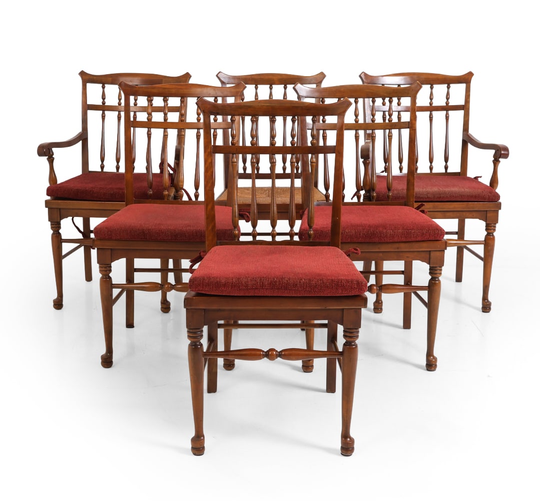 (6) WINDSOR STYLE WALNUT & RUSH DINING CHAIRS: Set of dining side chairs with walnut frames and woven rush seats. Paired with red velour cushions. Turned spindles and legs. 20th century. Dimensions: 37" x W 19" x D 18.25" x SH 18.25". Condition: P