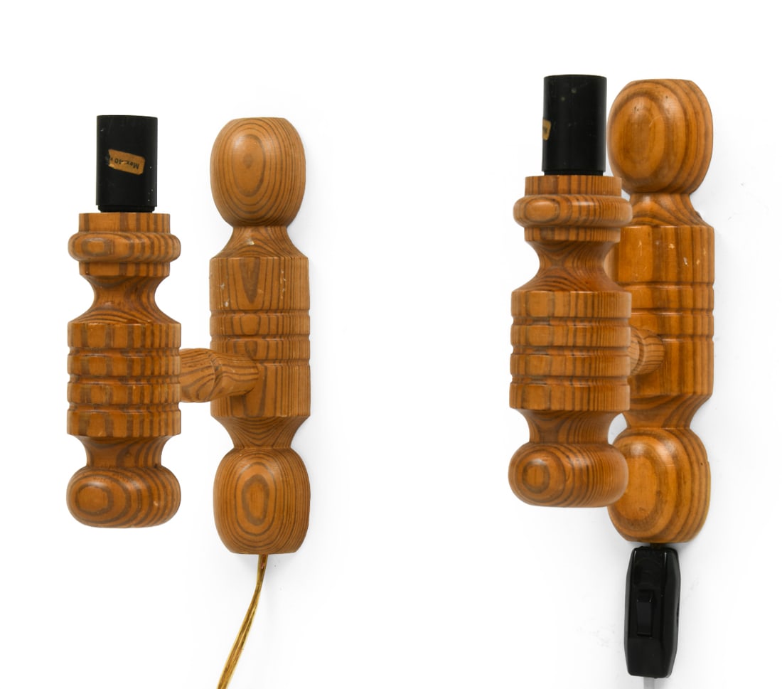 PAIR OF DANISH PINE WALL SCONCES C. 1970S: (2) Pine wall sconces with turned details. Denmark, circa 1970s. Dimensions: H 8.5" x W 2.5" x D 6.75". Condition: Small scuffs and dings. Wiring untested. Wear consistent with age and use.