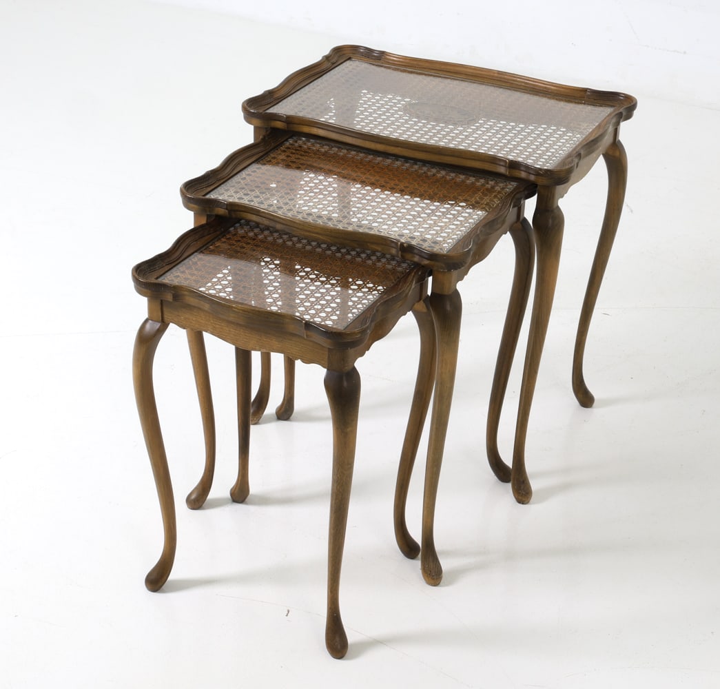 (3) JASON MOBLER DANISH CANED NESTING TABLES 1960S: Three nesting tables with cane and glass top in beech frame, featuring carved cabriole legs and a center medallion design. Denmark, circa 1960s. Dimensions: (Largest) H 21.5" x W 20.5" x D 14.5" Condi