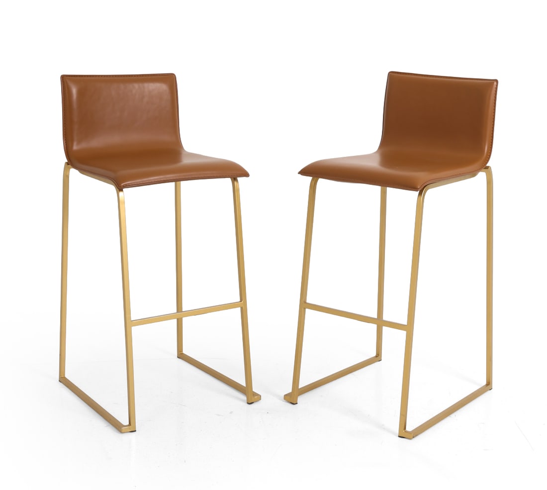 PAIR OF LUMISOURCE "MARA" BAR STOOLS: Camel faux leather upholstery and a gold-finished steel base. Marked and dated to frame. Contemporary. Dimensions: H 38.75" x W 17" x D 18.75" x SH 28.25" Condition: Light rubs to frame. Wear consiste