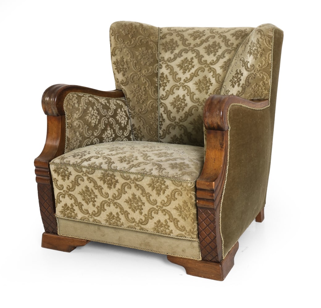 DANISH DECO STYLE VELOUR LOUNGE CHAIR C. 1940S: Lounge chair in floral damask patterned green velour upholstery and oak frame. Curved armrests and wing-style channel tufted back. Denmark, circa 1940s. Dimensions: H 33.5" x W 30" x D 31" x SH 15". C