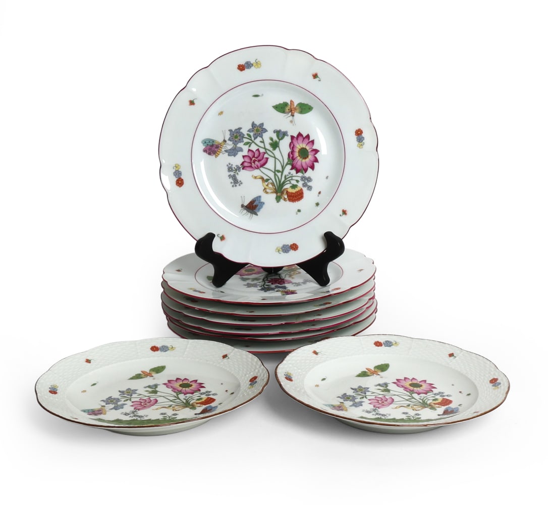 LIMOGES PORCELAIN PLATE GROUPING: Design by Charles Field Haviland, and inspiration of antique designs displayed at the Metropolitan Museum of Art. Dimensions: Largest Dia. 10". Condition: Small chip to edge of one. Previous repair