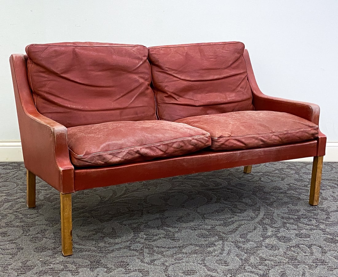 RUD THYGESEN FOR VEJEN VP 66/2 LEATHER LOVESEAT: Apparently unmarked. Denmark, circa 1960s. Dimension: H 28" x W 51.75" x D 30" x Sh 16.5" Condition: Rubs and scuffs. Heavy fading to armrest and cushions, Wear consistent with age and use.