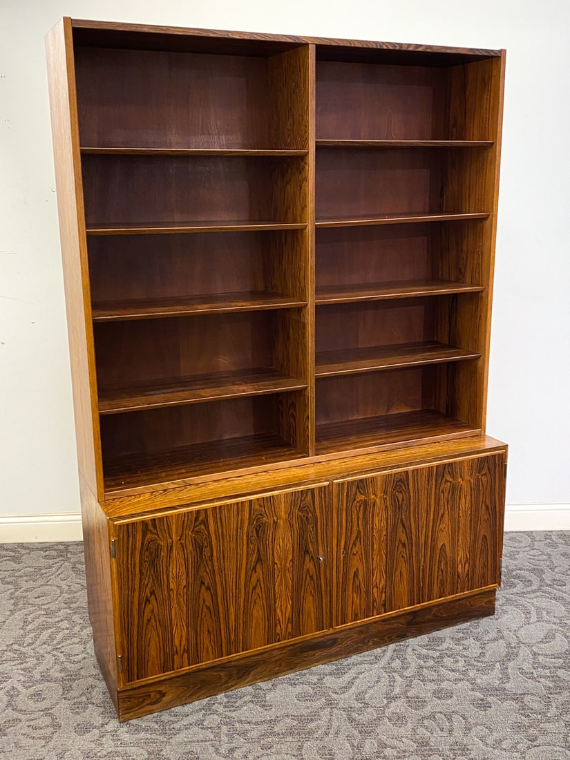 POUL HUNDEVAD DANISH ROSEWOOD BOOKCASE C. 1960S: Marked to back. Adjustable shelves. Denmark, circa 1960s. Dimensions: H 77" x W 54.5" x D 17". Condition: Hole to back. Few scuffs and scratches. Wear consistent with age and use.