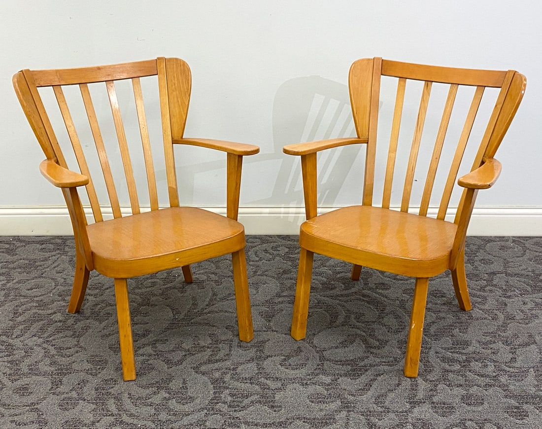 PAIR CHRISTIAN HANSEN FOR FRITZ HANSEN ARMCHAIRS: Model "Canada" chairs. Beech frame. Remnants of a label on undersides. Dimension: H 31.5" x W 24.75" x D 25" x Sh 14.5" Condition: Minor dings and rubs to armrest and backrest, Wear consistent with ag