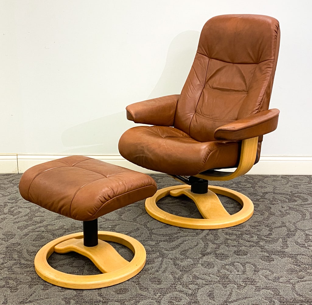 FJORDS MULDAL 215 RECLINING CHAIR & OTTOMAN: Leather upholstery and beech frame. Marked and dated 2002 to frame. Norway. Dimension: H 39.5" x W 29.5" x D 28.5" x Sh 16.5" Ottoman H 16" x W 18.5" x D 15.5" Condition: Surface cracking and discolor