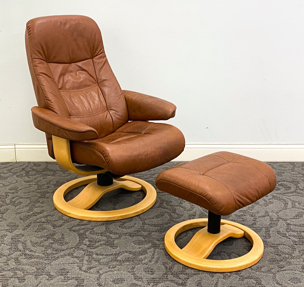 HJELLEGJERDE MULDAL 215 RECLINING CHAIR & OTTOMAN: Leather upholstery and beech frame. Marked and dated 2002 to frame. Norway. Dimensions: H 40" x W 29" x D 27" x SH 17" Condition: Wear consistent with age and use.