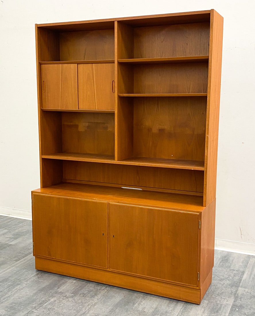 POUL HUNDEVAD DANISH TEAK BOOKCASE CABINET 1960S: Marked to back. Key included. Denmark, circa 1960s. Dimensions: H 77" x W 54" x D 17" Condition: Wear consistent with age and use. Some nicks to edges.