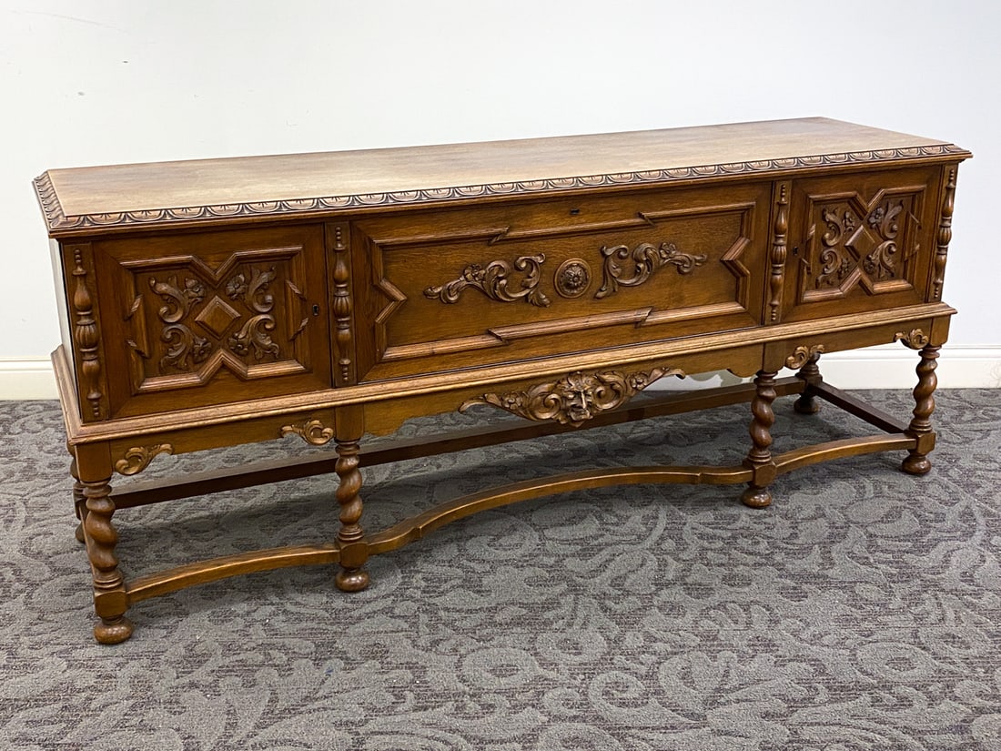 BAROQUE STYLE DANISH OAK SIDEBOARD: Key Included. Denmark. Dimensions: H 33.25" x W 81" x D 21" Condition: Sun-fading to top, Dings and rubs to top and sides, Wear consistent with age and use.