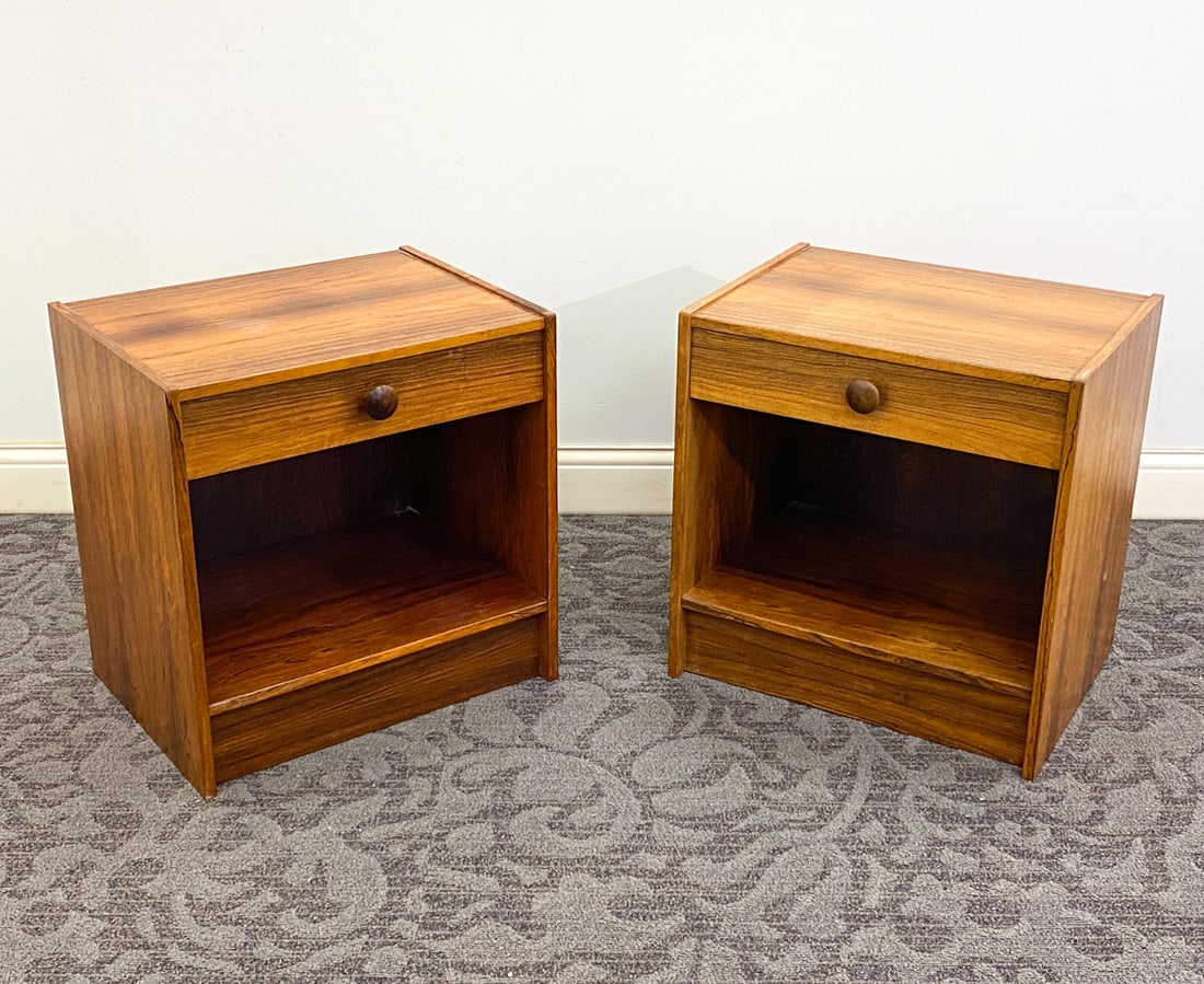 PAIR OF DANISH ROSEWOOD NIGHTSTANDS C. 1960S: Denmark, circa 1960s. Dimension: H 22.5" x W 21.75" x D 16.25" Condition: Loss to base, Wear consistent with age and use including dings and rubs to top and sides. Fading.