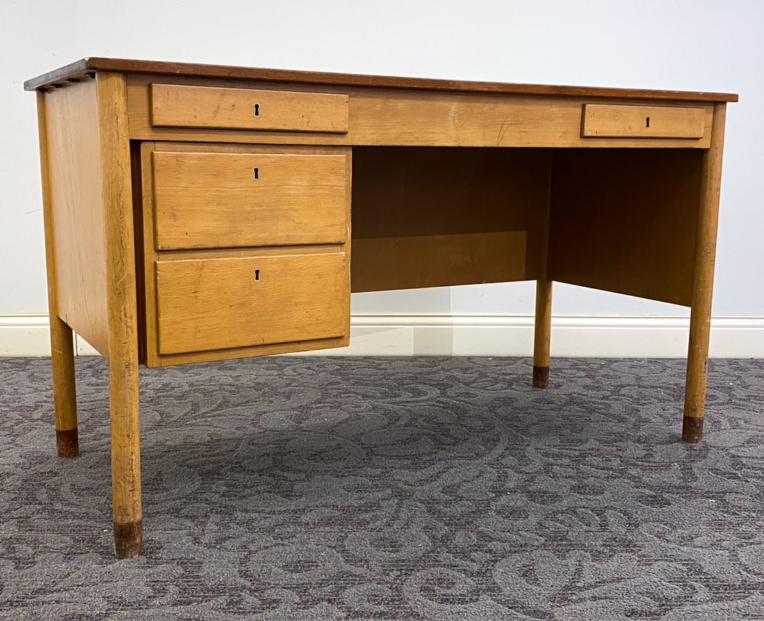 SCANDINAVIAN BEECH DESK C. 1960S: Apparently unmarked. Dimension: H 29.25" x W 51.25" x D 23.75" Condition: Dings and rubs to table top and legs, child's scribbles on insides of drawers, Wear consistent with age and use. No key Includ