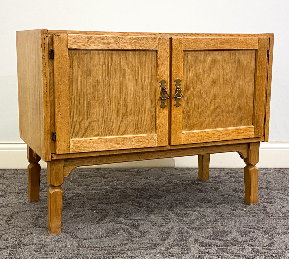 KJAERNULF STYLE DANISH OAK CABINET C. 1970S: One interior shelf. Dimensions: H 25.25" x W 33" x D 17" Condition: Light surface wear consistent with age and use. Hole cut out to back panel.