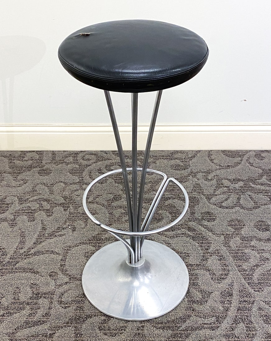 PIET HEIN FOR FRITZ HANSEN CHROME COUNTER STOOL: Leather upholstery. Marked underneath. Denmark, circa 1960s. Dimensions: H 31.5" x Dia. 13.75" Condition: Wear consistent with age and use including scuffs and dings to base and seat.